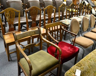 Lot 1177 - A set of four Georgian Provincial elm hump back dining chairs, three similar dining chairs and...