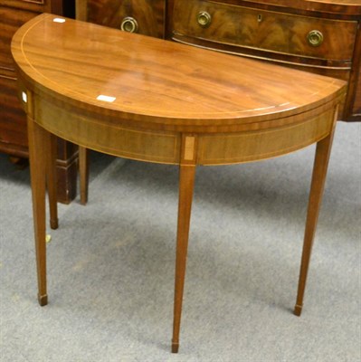 Lot 1183 - An Edwardian demi-lune fold over card table