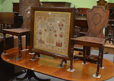 Lot 1206 - A pair of Regency oak hall chairs