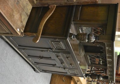 Lot 1216 - A 1920's oak court cupboard with lead glazed upper section