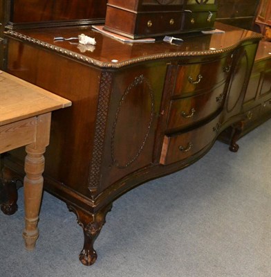 Lot 1224 - An early 20th century mahogany large serpentine front sideboard