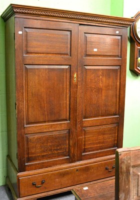 Lot 1232 - An 18th century oak press cupboard converted to a wardrobe