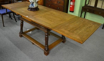 Lot 1239 - Fruitwood draw leaf dining table