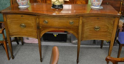 Lot 1241 - A George III checkered strung inlaid mahogany bow fronted sideboard