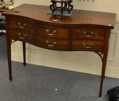 Lot 1249 - Serpentine mahogany sideboard