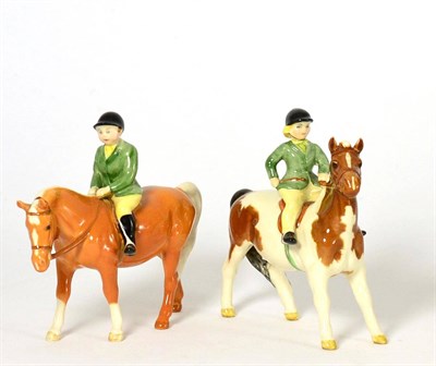 Lot 86 - Beswick Girl on Pony, model No. 1499, Skewbald gloss; together with Boy on Pony, model No....