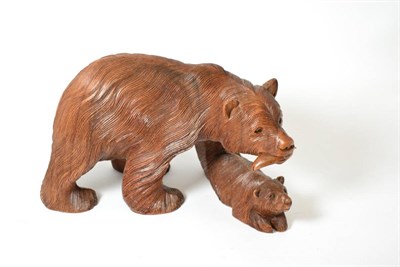 Lot 115 - A carved wooden sculpture of a bear and cub