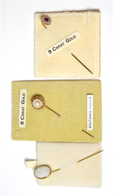 Lot 154 - An opal stick pin (crazed), a cultured pearl stick pin and a ruby and cubic zirconia stick pin (3)