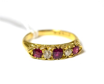 Lot 171 - A ruby and diamond five stone ring on 18ct gold band