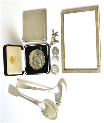 Lot 177 - A group of silver including an Irish spoon, Dublin, a sauce ladle, photograph frame, cigarette...