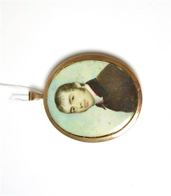 Lot 193 - A 19th century portrait miniature on ivory of a young gentleman, in a yellow metal mount and backed