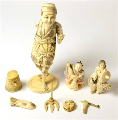 Lot 196 - A Japanese Meiji period ivory okimono together with two netsukes circa 1910/20