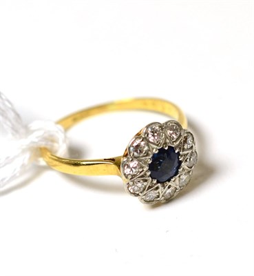 Lot 217 - A sapphire and diamond flower head cluster ring