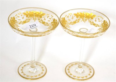Lot 229 - A pair of Edwardian engraved and gilt glass stem dishes