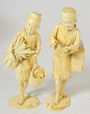 Lot 232 - A pair of Japanese Meiji period ivory okimonos of market sellers