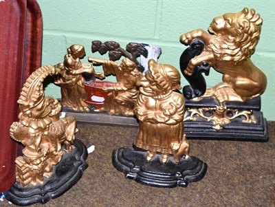Lot 263 - Four Victorian painted cast iron door stops including a Lion Passant, Punch & Judy, etc