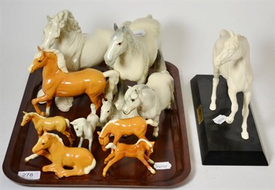Lot 278 - A small collection of Beswick horses including palomino and grey models