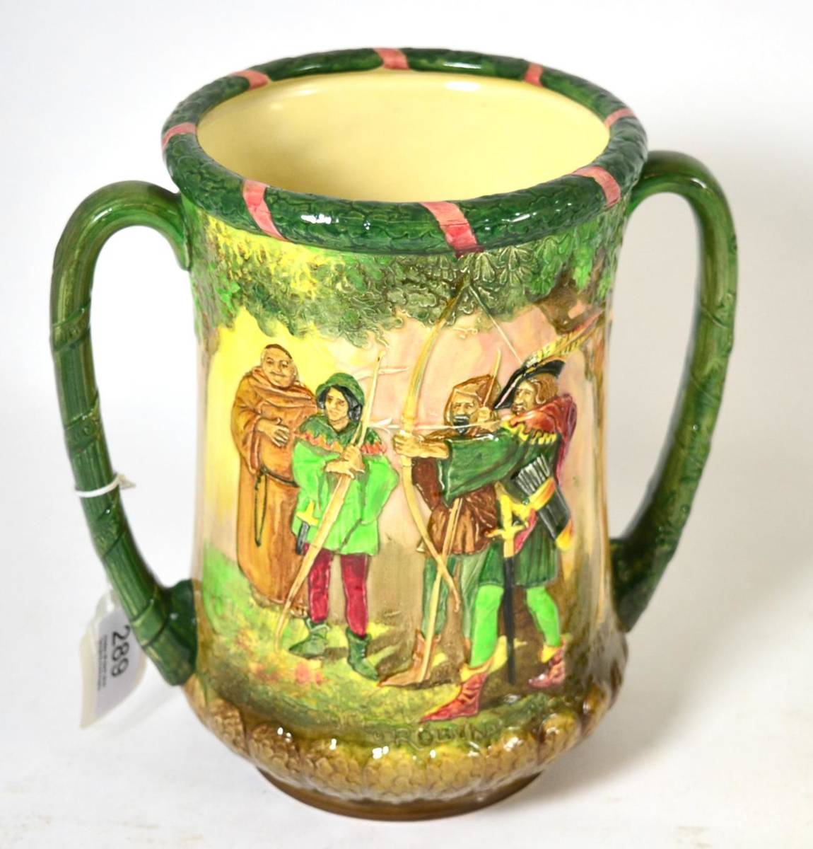 Lot 289 - A Royal Doulton twin-handled Robin Hood loving cup, designed by Harry Fenton and Charles Noke,...