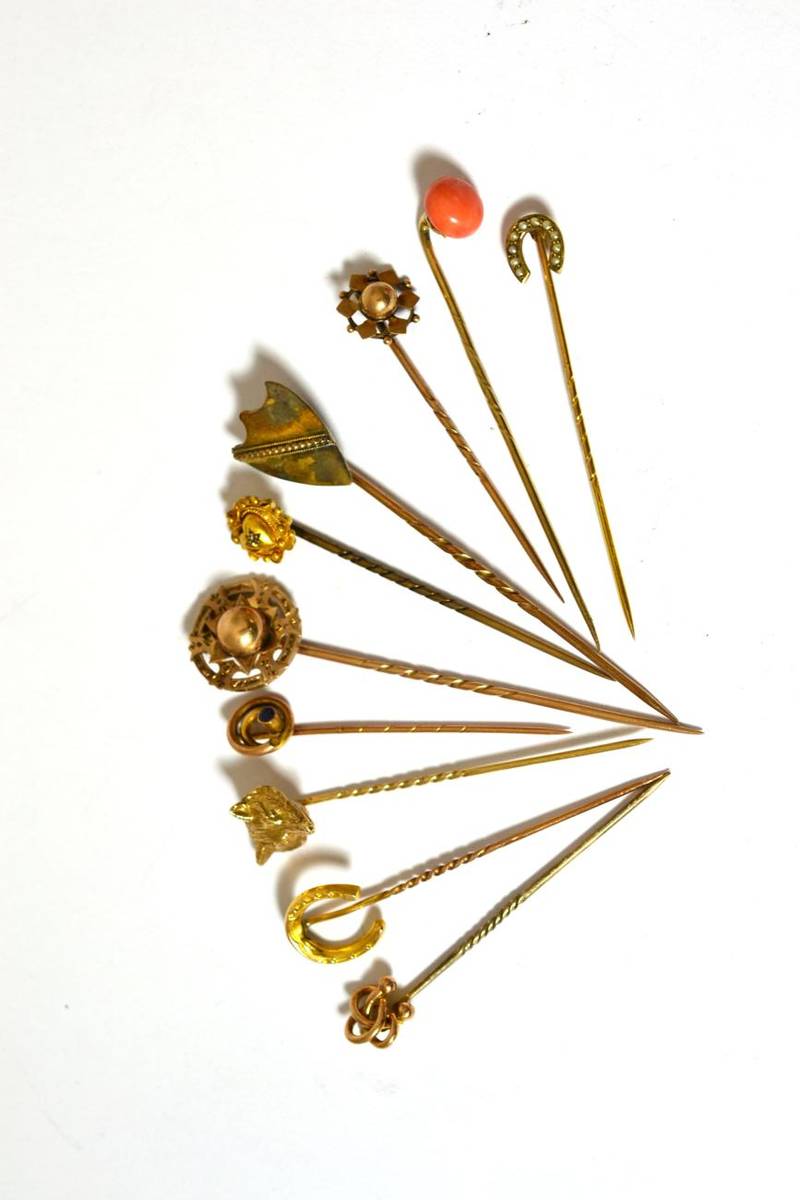 Lot 360 - A group of ten stick pins comprising: 9ct