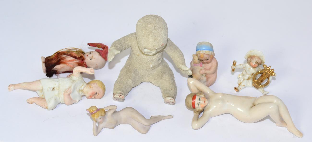 Lot 395 - Snow babies, two nude ladies and cake decorations