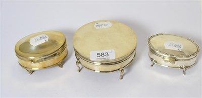 Lot 583 - An Edwardian silver dressing table box and two others