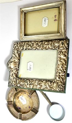Lot 584 - A pair of silver golf club ashtrays, two silver frames and a magnifying glass