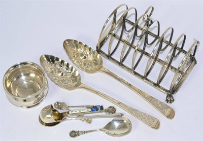 Lot 588 - A George III silver toast rack, two berry spoons (later embossed) and a small silver bowl
