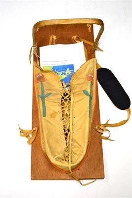 Lot 602 - A circa 1971 North American Indian leather and beadwork applique baby papoose and a Shaman deer...