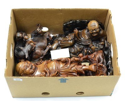 Lot 604 - A group of S.E. Asian hardwood figural carvings including a pair of water buffalo and two deities
