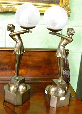 Lot 605 - A pair of Art Deco style lamps
