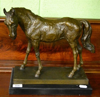 Lot 606 - A bronze model of a horse on marble plinth base