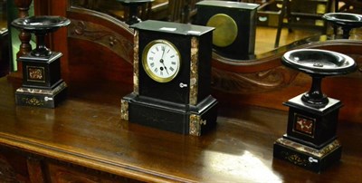 Lot 609 - A black slate and marble clock garniture, of architectural form flanked by urns