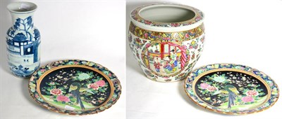 Lot 668 - Cantonese planter, Chinese blue and white vase and a pair of chargers