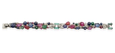 Lot 297 - A Multi-Gemstone and Diamond Bracelet, of carved and cabochon emeralds, sapphires and rubies to...