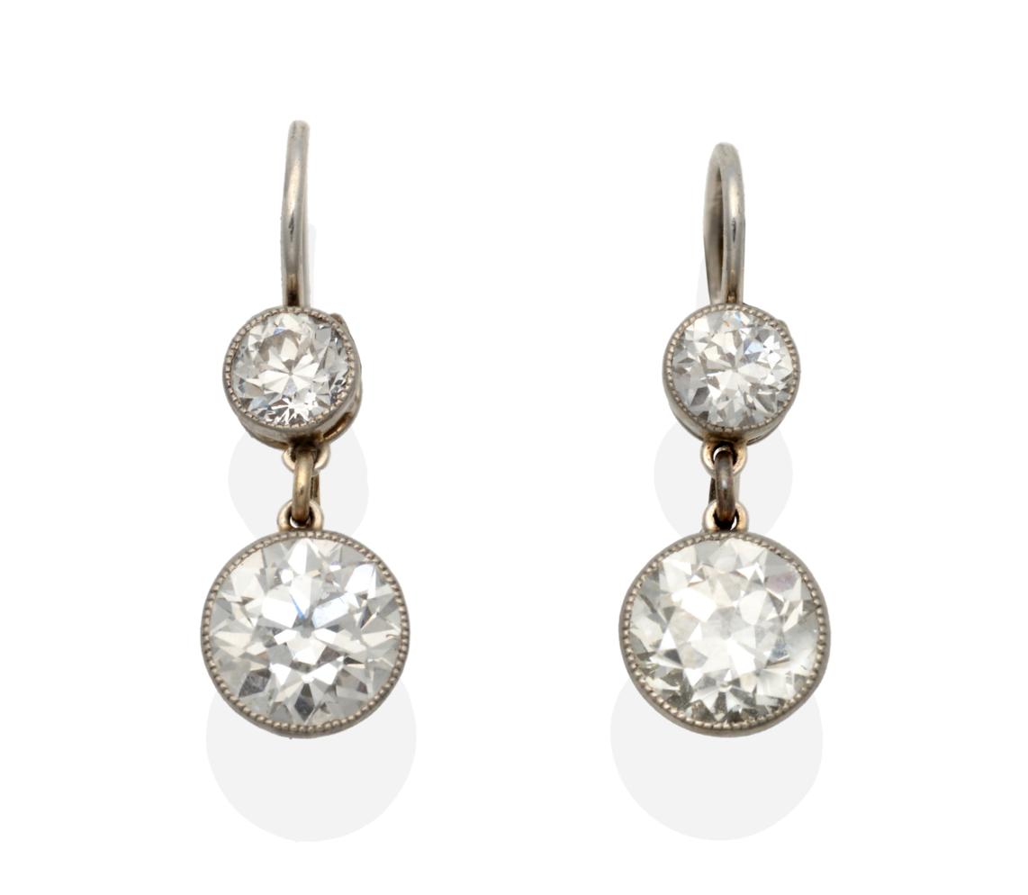Lot 298 - A Pair of Old Cut Diamond Drop Earrings, an old cut diamond in a white milgrain setting...