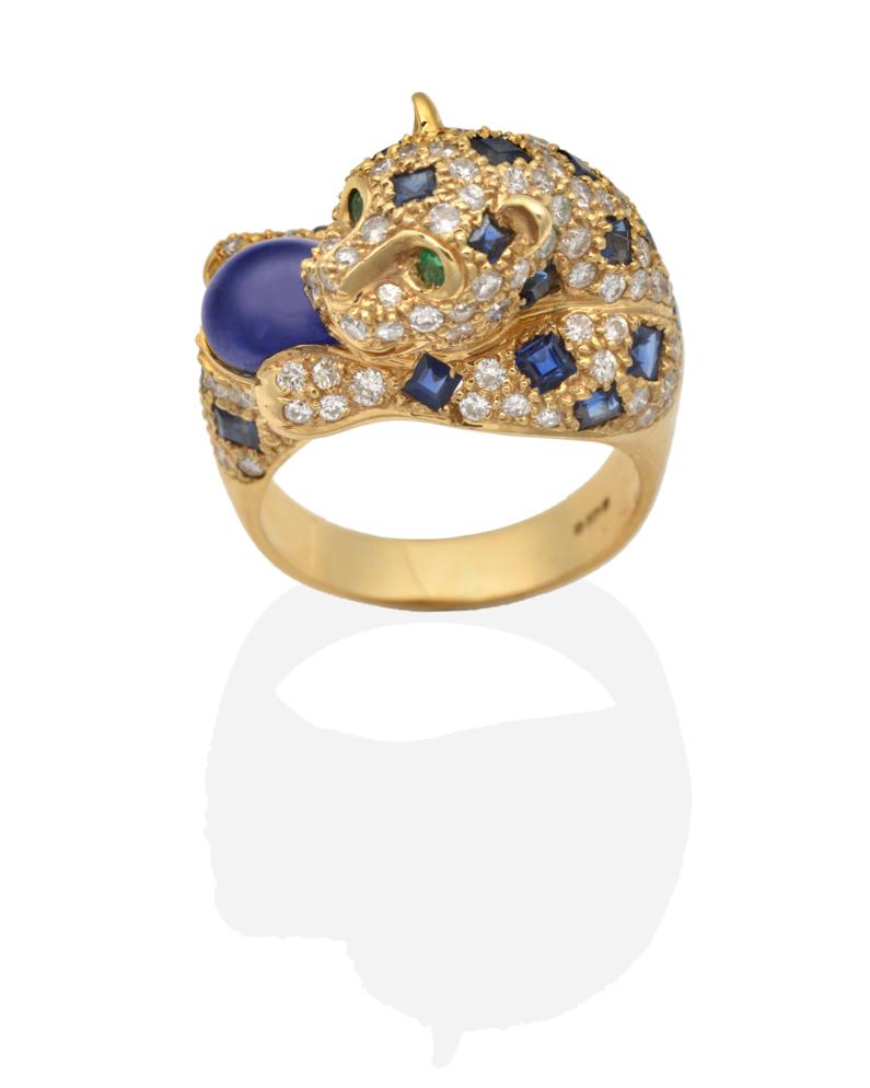 Lot 318 - An 18 Carat Gold Sapphire, Diamond and Emerald Panther Ring, modelled as a panther pavé set with