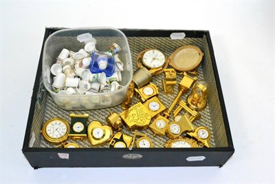 Lot 18 - A collection of 20th century miniature timepieces and thimbles (qty)
