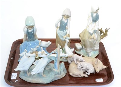 Lot 24 - Five various Lladro figures, girls with geese, pig and piglets etc (5)