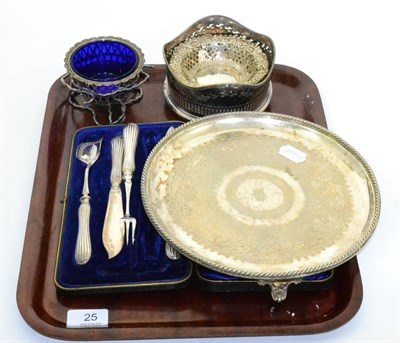 Lot 25 - A plated bottle coaster, silver pierced dishes and a plated tray