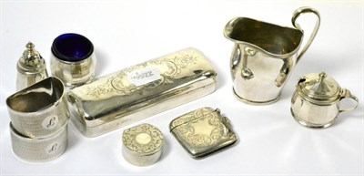 Lot 65 - A selection of silver items comprising milk jug, rectangular box, vesta case, two napkins...