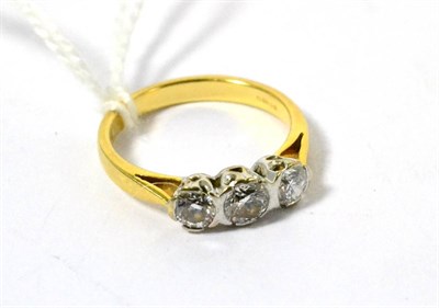 Lot 71 - An 18ct yellow gold three stone diamond ring, brilliant cut, approximately 0.68 carat in total