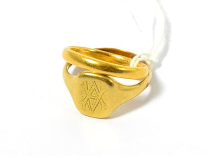 Lot 92 - A yellow metal signet ring together with a yellow metal band ring