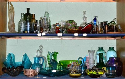 Lot 104 - Two shelves of Victorian and later glassware including bottles, figures, glasses, vases, Murano...