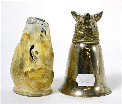 Lot 115 - A white metal fox head stirrup cup together with a pottery stirrup cup in the form of a dog's head