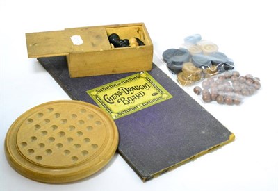 Lot 131 - A collection of vintage games including a solitaire board, chess pieces, draughts etc
