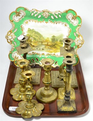 Lot 139 - Brass candlesticks and an early 19th century porcelain dish, part gilt and painted with a scene...