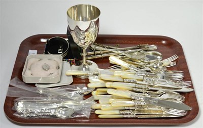 Lot 152 - A silver goblet, various silver teaspoons, silver bangles, silver locket, silver tie pin and a...