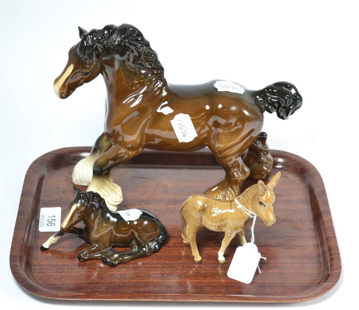 Lot 156 - Two Beswick horses and a Beswick donkey