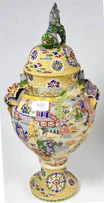 Lot 168 - A Japanese earthenware moriage ware vase and cover, decorated in bright enamels with figures...