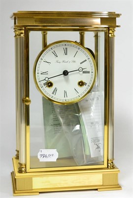 Lot 169 - A mantel clock, with service record, guarantee and instructions